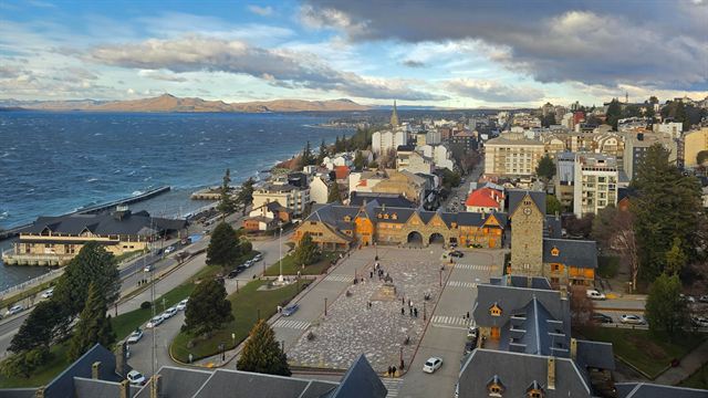 Aerial view of Bariloche's stone-built Centro Civico square and town beside Lake Nahuel Huapi