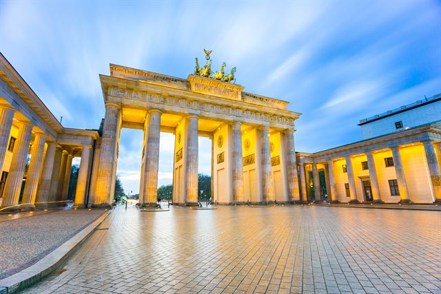 Brandenburg Gate in Berlin illuminated at night on the empty Pariser Platz