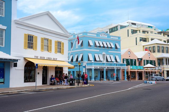 Pastel-painted shops with white roofs along Front Street in downtown Hamilton, Bermuda