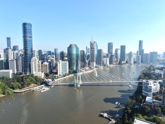 Brisbane CBD towers along the Brisbane River with the Kurilpa pedestrian bridge, aerial view