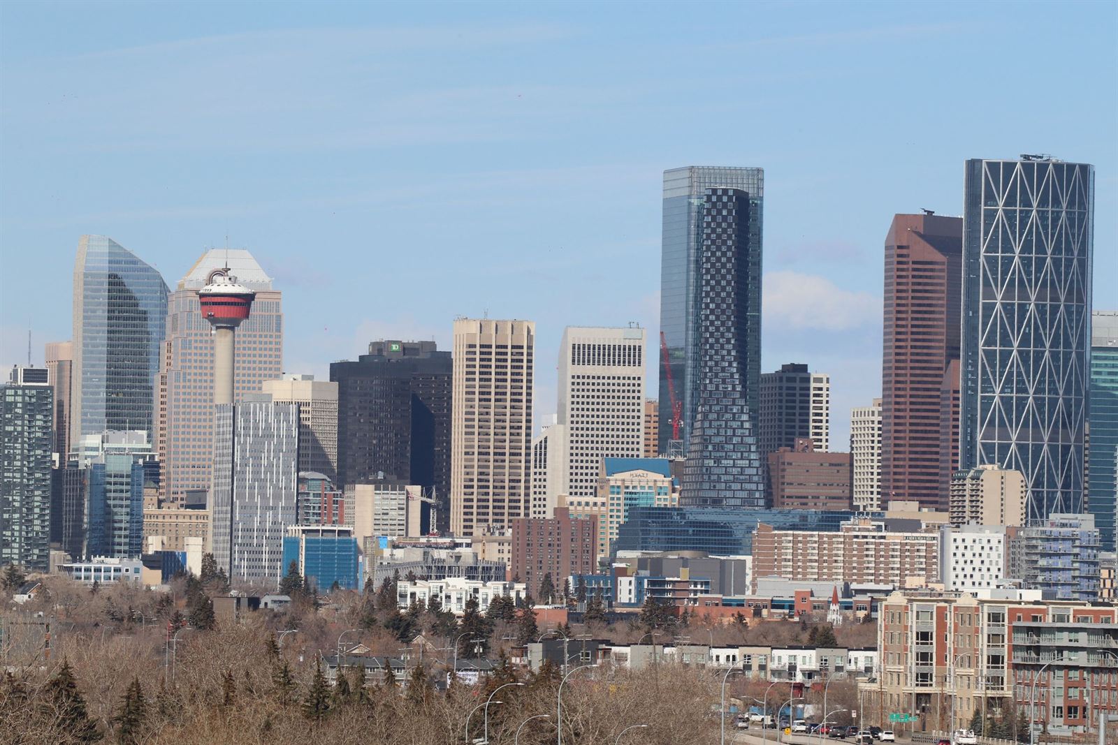 Downtown Calgary skyline with the Calgary Tower, the Bow and Telus Sky towers under a blue sky