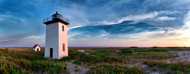 Wood End Lighthouse among dunes at sunset near Provincetown, Cape Cod