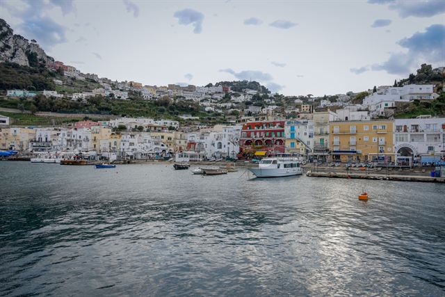 Marina Grande harbor on Capri with pastel waterfront buildings and moored boats