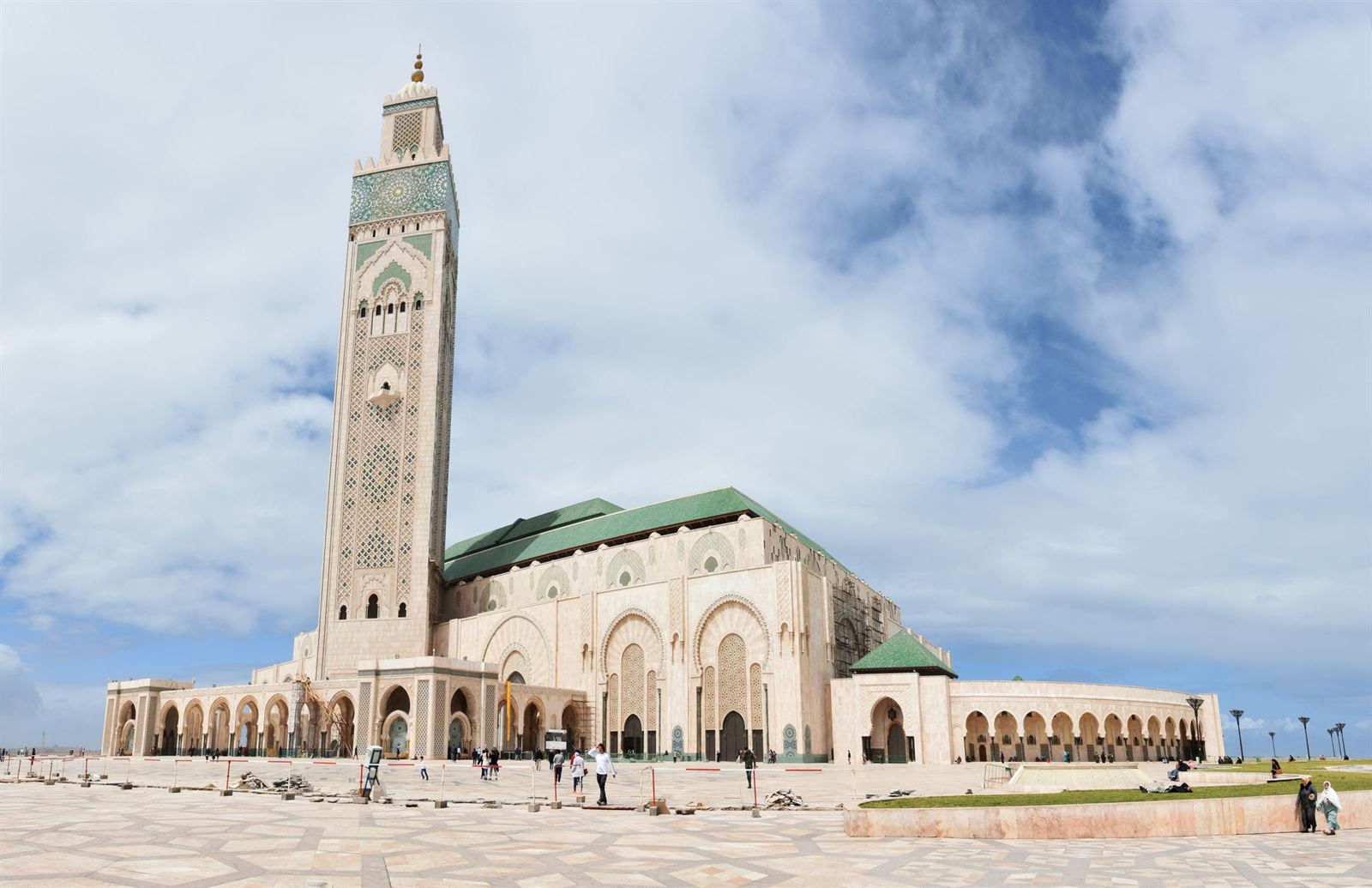 Hassan II Mosque with its tall decorated minaret and green-tiled roofs on the Casablanca waterfront