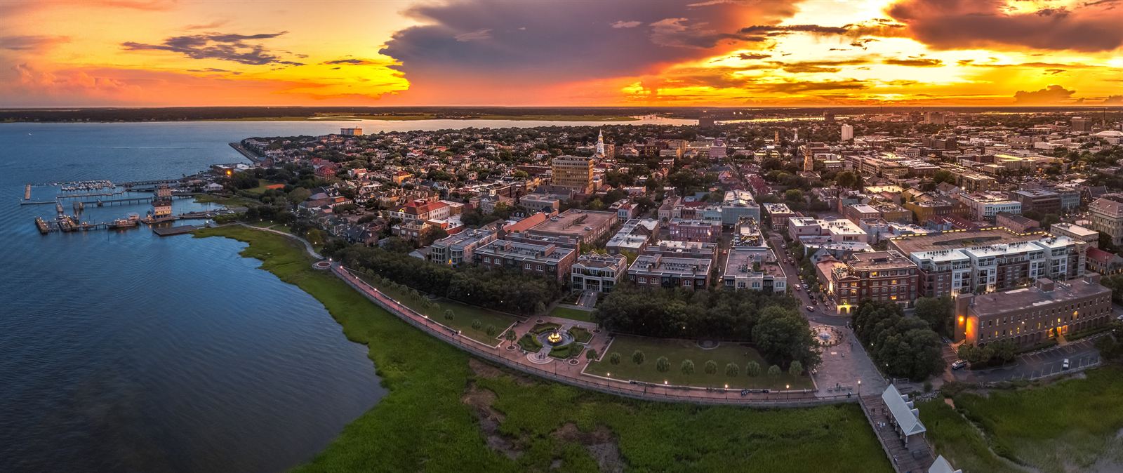 Aerial view of Charleston, South Carolina, and its harbor waterfront at sunset