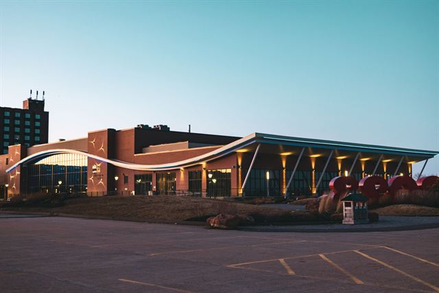 The PEI Convention Centre in downtown Charlottetown with its curved roofline at twilight