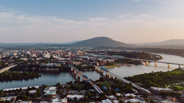 Chattanooga skyline, riverfront bridges and Lookout Mountain seen from above at sunset