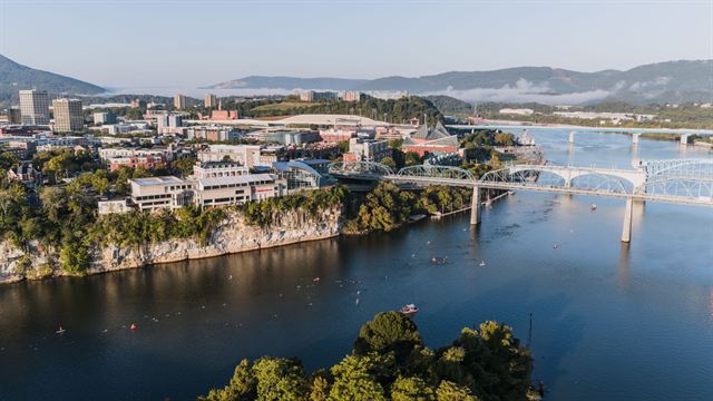 Aerial view of bridges spanning the Tennessee River below the bluff and downtown Chattanooga
