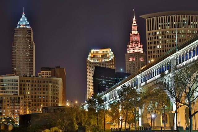 Cleveland at night with Key Tower, Terminal Tower and the lit arches of the Detroit-Superior Bridge