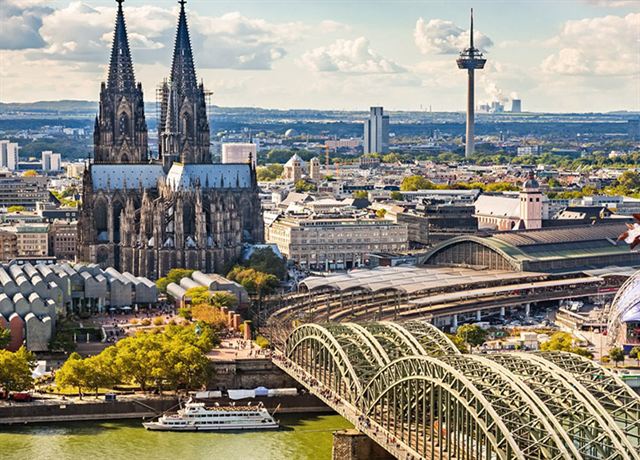 Aerial view of Cologne Cathedral, Hohenzollern Bridge and the city beside the Rhine