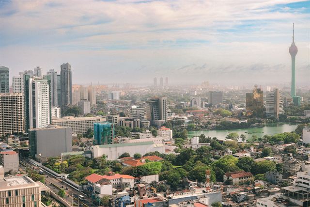 Colombo cityscape with high-rises, Beira Lake and the Lotus Tower spire on the right
