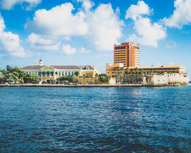 Governor's Palace, Fort Amsterdam walls and the Plaza hotel tower across St. Anna Bay in Willemstad, Curacao