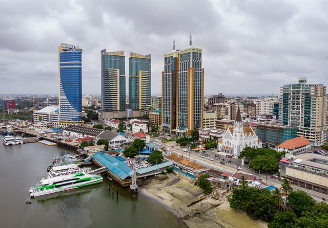 Aerial view of Dar es Salaam's harbor ferry terminal and high-rise towers