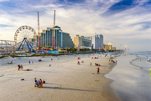 Daytona Beach with the boardwalk Ferris wheel, roller coaster and beachfront hotels