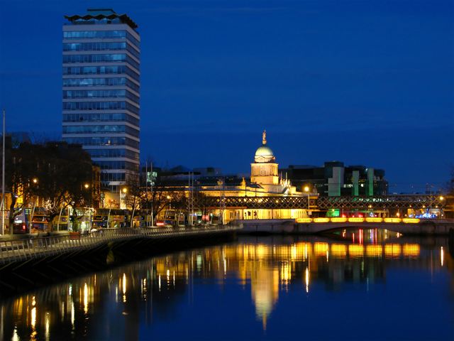 The Custom House lit at night on the River Liffey