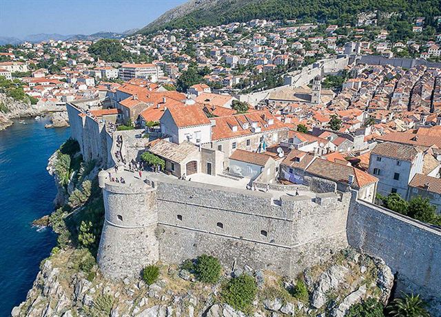 Aerial view of Dubrovnik fortress walls and red roofs of the Old Town on the Adriatic