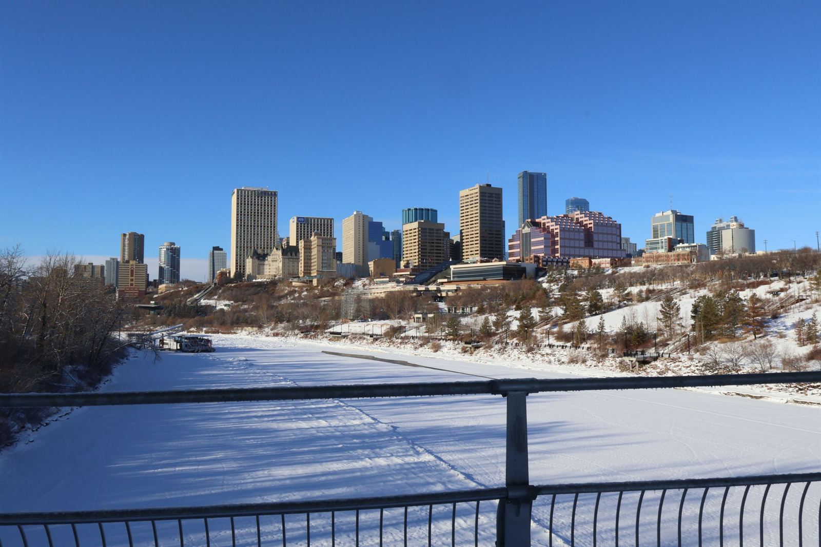 Edmonton downtown skyline above the snow-covered North Saskatchewan River valley on a clear winter day