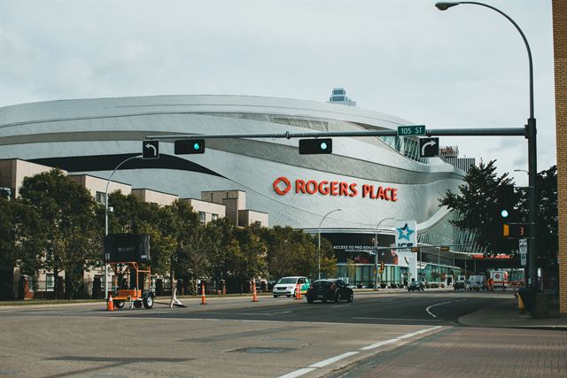 Rogers Place arena and a downtown street intersection in Edmonton, Alberta