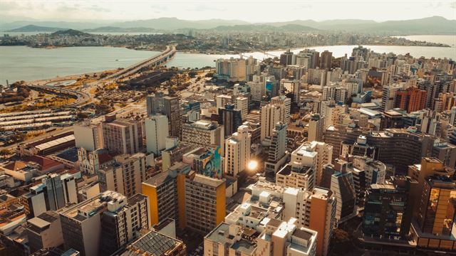 Aerial view of downtown Florianopolis high-rises with the bridges and bay stretching to the mainland