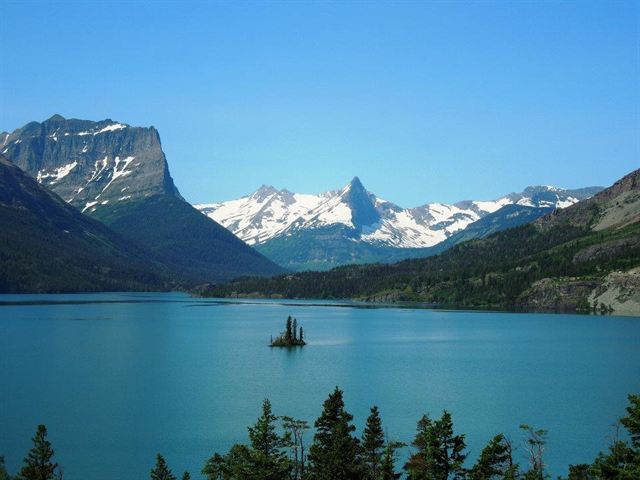 St. Mary Lake and Wild Goose Island below snow-capped peaks in Glacier National Park, Montana