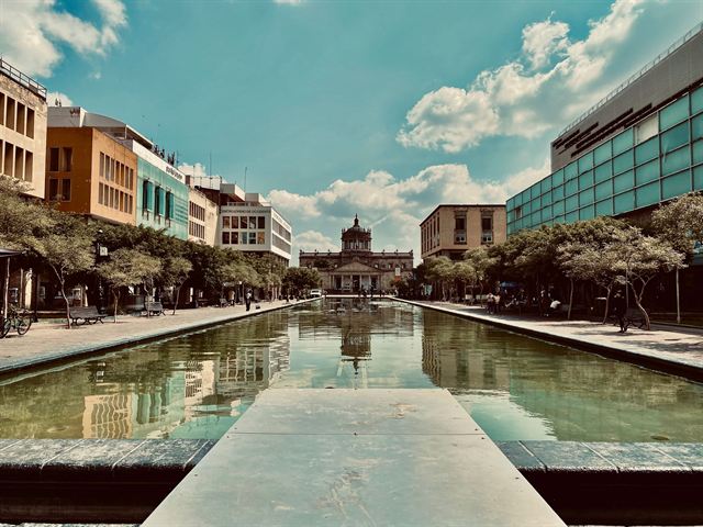 Long reflecting pools of Plaza Tapatia leading to the domed Hospicio Cabanas in Guadalajara