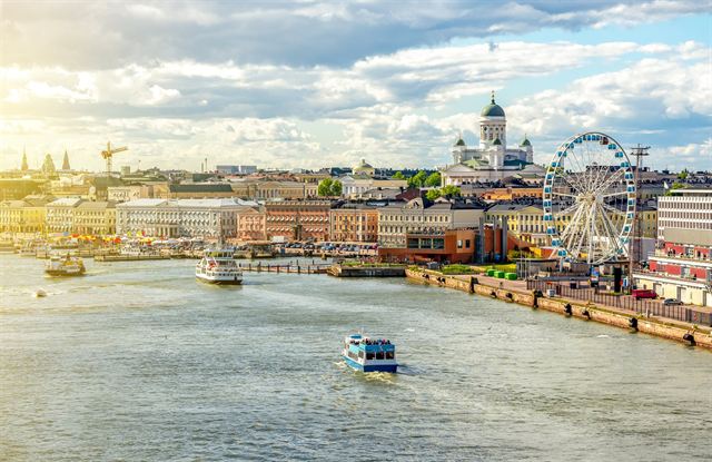 Helsinki South Harbour waterfront with ferries, the SkyWheel and the white-domed Helsinki Cathedral skyline