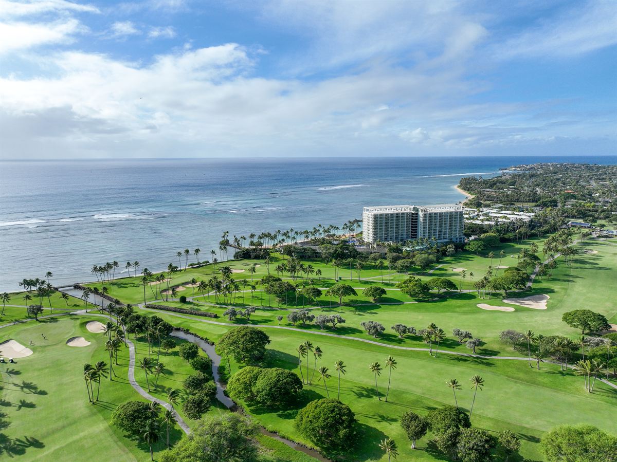 Aerial view of The Kahala Hotel on the shoreline beside the Waialae golf course, Honolulu