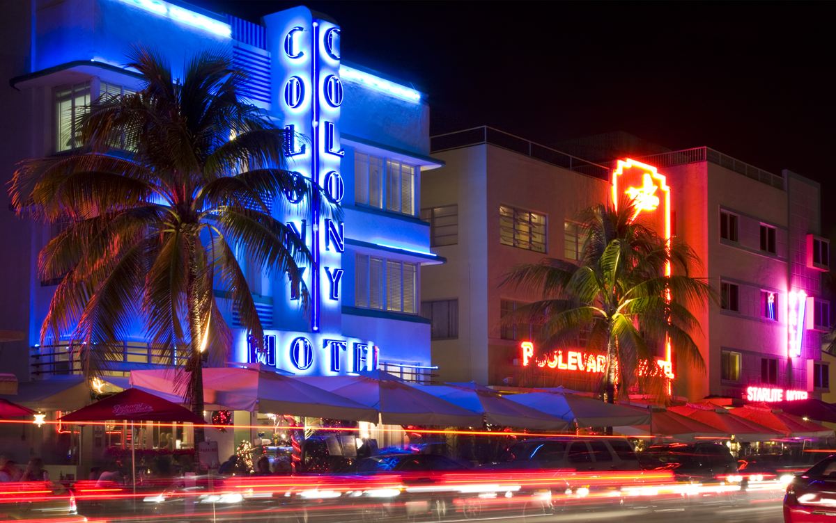 The Colony Hotel's blue neon sign on Ocean Drive, Miami Beach, at night