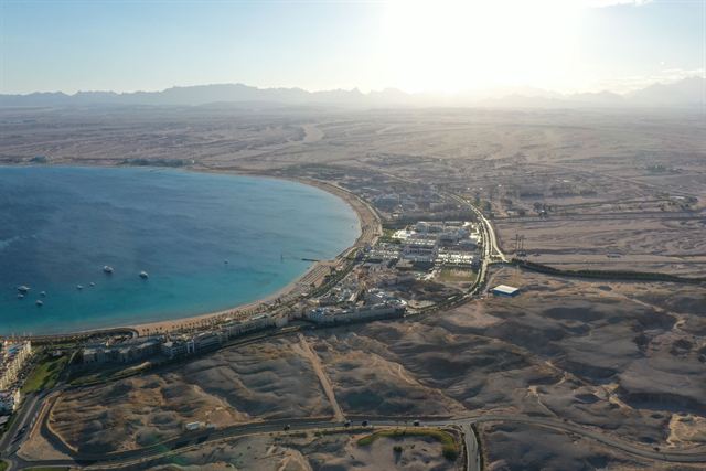 Aerial view of the crescent Sahl Hasheesh bay and desert coastline south of Hurghada, Egypt