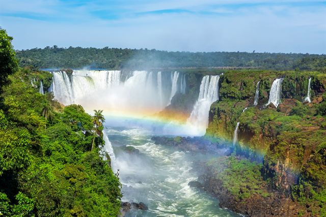 Iguazu Falls with a rainbow over the gorge on the Brazil-Argentina border