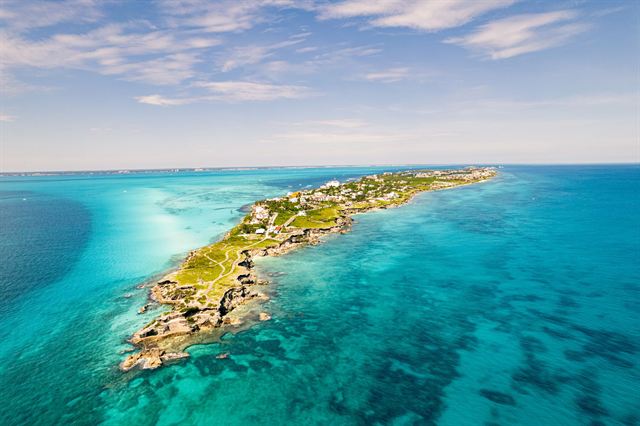 Aerial view of the narrow southern tip of Isla Mujeres surrounded by turquoise Caribbean water