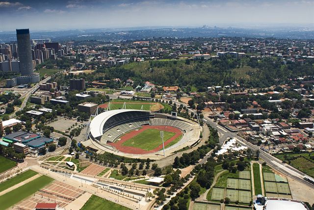 Aerial view of Johannesburg stadium and surrounding suburbs with the city skyline