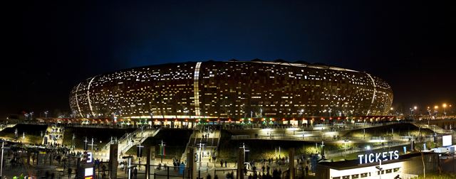 FNB Stadium (Soccer City) lit up at night in Johannesburg