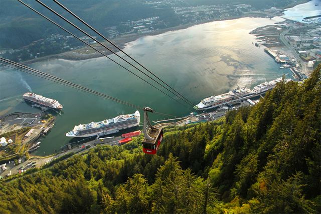 Mount Roberts Tramway above cruise ships docked along the Gastineau Channel in Juneau, Alaska
