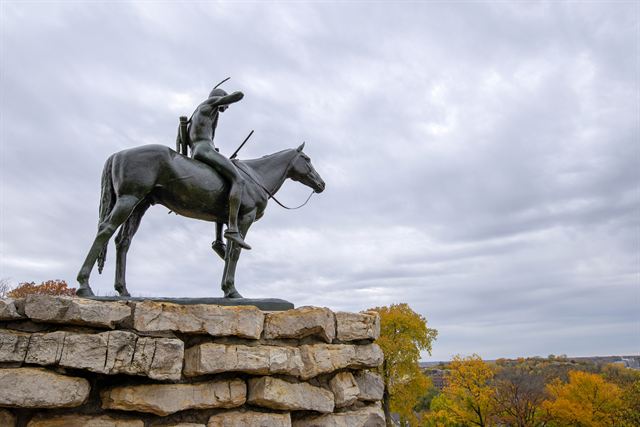 The Scout statue of a mounted Native American on a stone base, Kansas City