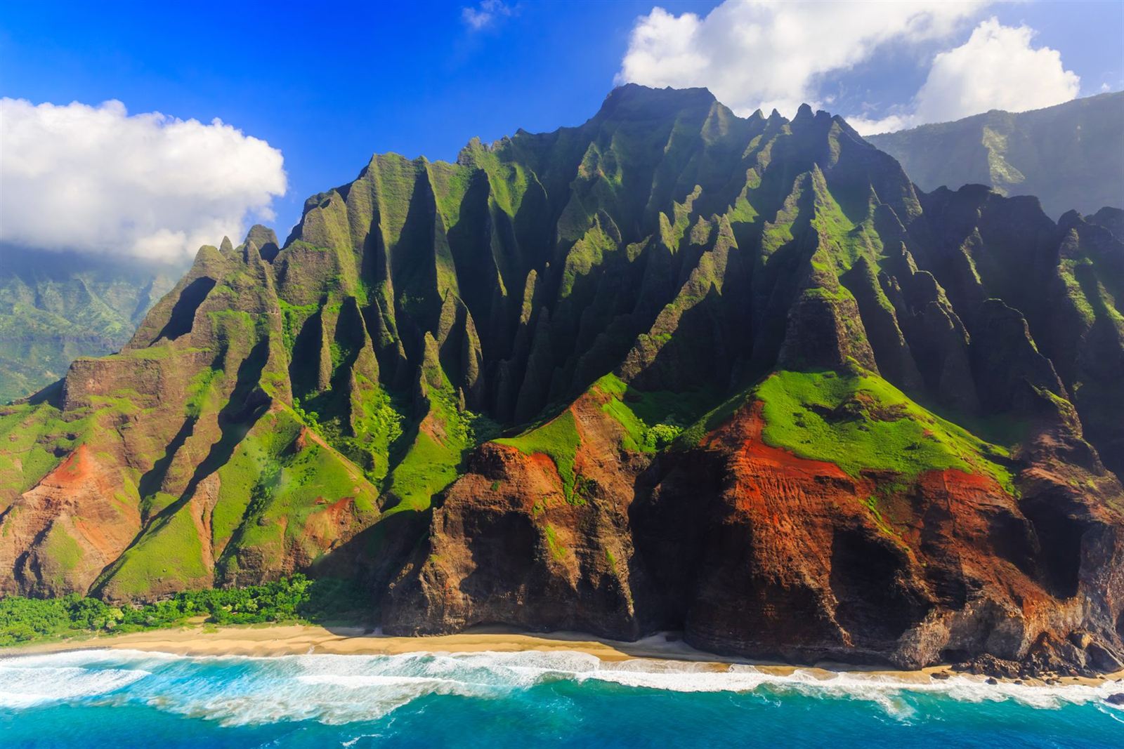 Aerial view of the jagged green Na Pali Coast cliffs