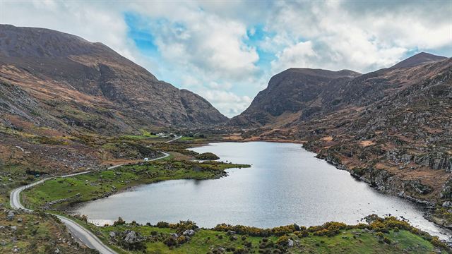 Aerial view of the Gap of Dunloe near Killarney, a lake and winding road between rugged mountains