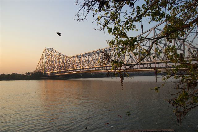 Howrah Bridge steel cantilever span over the Hooghly River in Kolkata at dusk