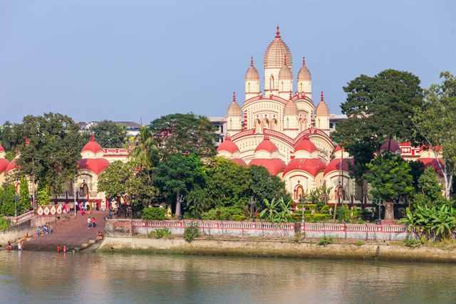 Dakshineswar Kali Temple with red-and-white spires on the Hooghly riverbank, Kolkata