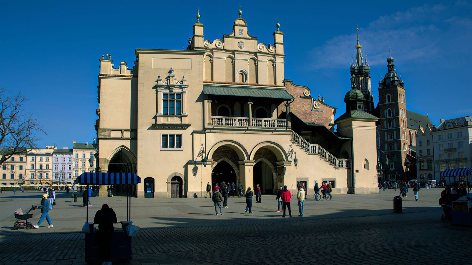 Krakow Main Market Square with the Renaissance Cloth Hall (Sukiennice) and St. Mary's Basilica towers