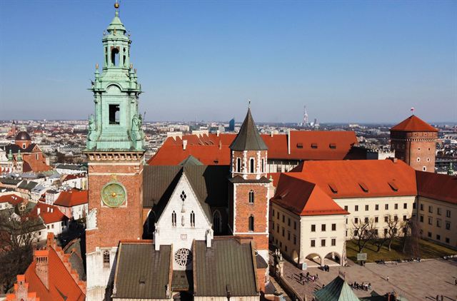 Aerial view of Wawel Castle and Cathedral in Krakow with green-domed clock tower and red roofs