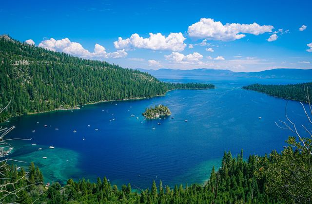 Emerald Bay and tiny Fannette Island ringed by pine forest with Lake Tahoe's deep blue water beyond