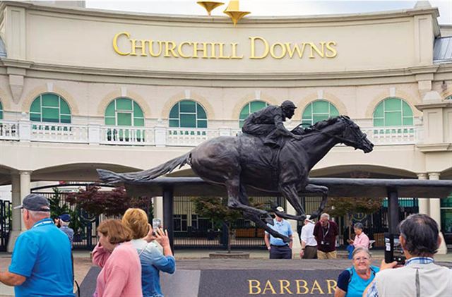 Visitors at the Barbaro statue in front of the Churchill Downs entrance, Louisville