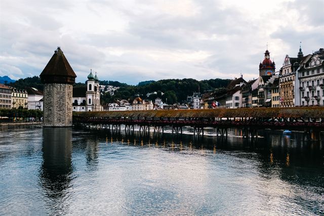 Chapel Bridge (Kapellbrücke) and octagonal Water Tower on the Reuss River with Lucerne old town