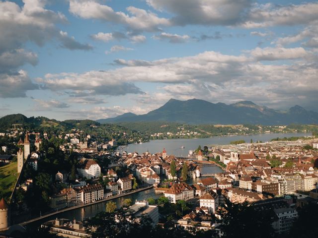 Elevated view over Lucerne's rooftops, the Reuss River and Lake Lucerne with mountains