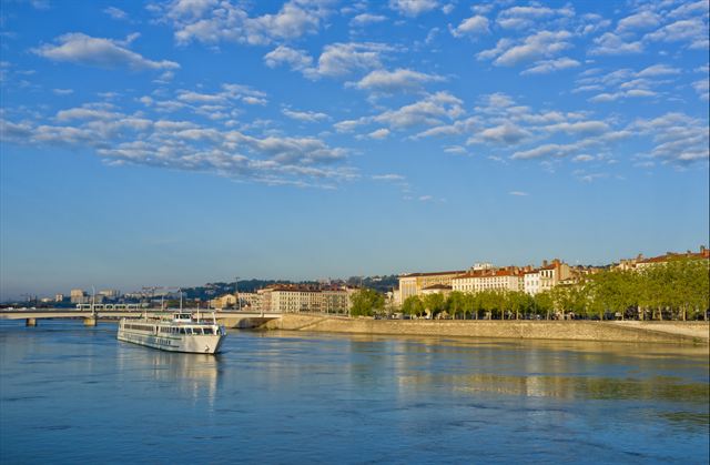 River cruise ship on the Rhone passing Lyon's riverside quays