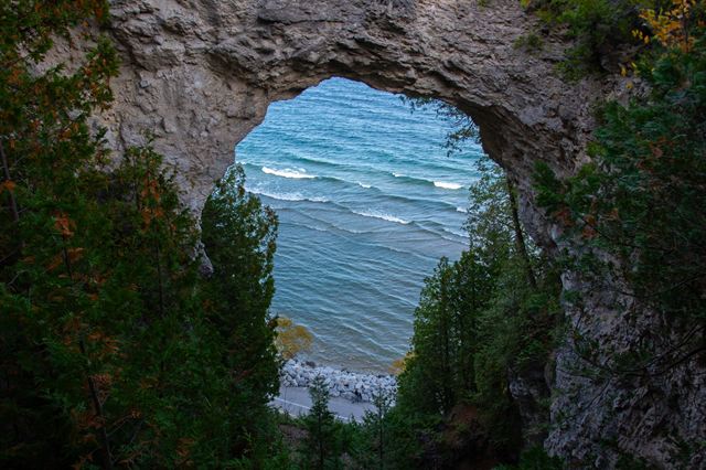 Arch Rock natural limestone arch framing blue Lake Huron on Mackinac Island