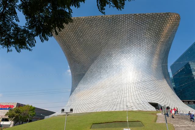 Curving silver-tiled facade of the Museo Soumaya in Mexico City's Polanco district