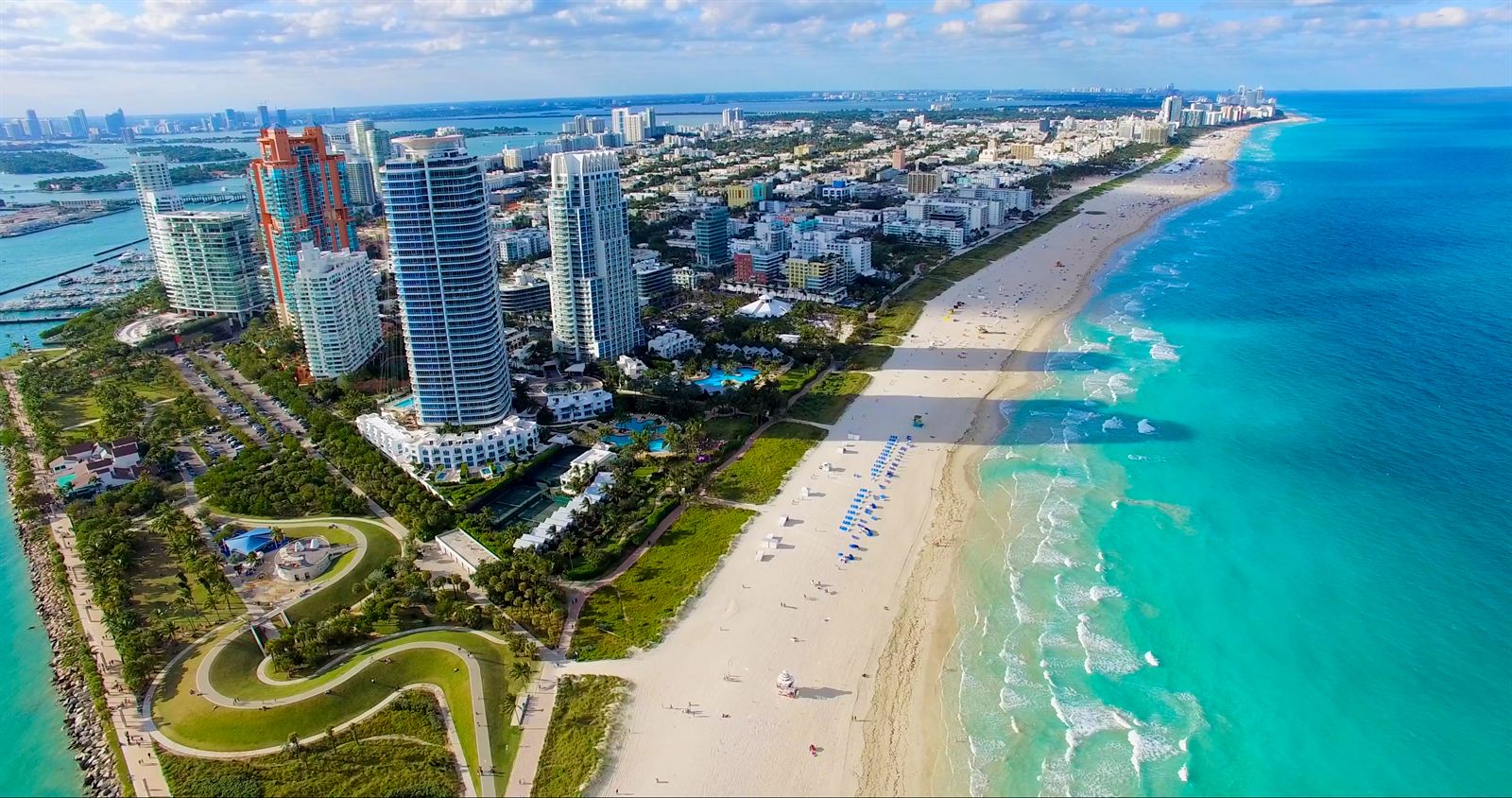 Aerial view of Miami Beach from South Pointe with high-rises, beach and turquoise water
