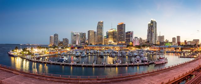 Downtown Miami skyline and Bayside marina at dusk